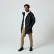En skön och vattentät Tretorn Wings Plus Eco regnjacka (unisex) på en modell med öppen framsida