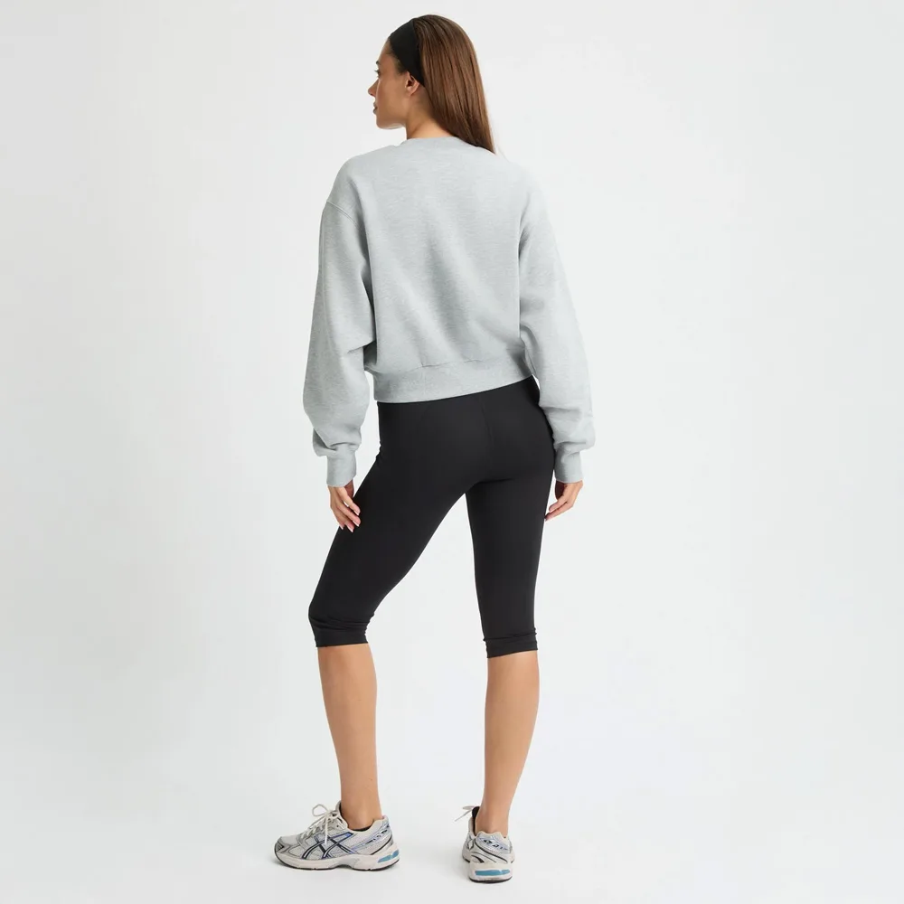 baksida av Röhnisch Flattering High Waist Capri Tights träningstights (dam)