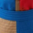 detaljer på en Reima Sunhat Siimaa solhatt (barn)