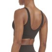 Närbild på ryggtavla på en modell som bär Adidas Scoop Lounge Seamless Bra sportbh (dam