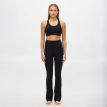 en modell bär Röhnisch Legacy Flare High Waist Tights yogabyxor (dam)